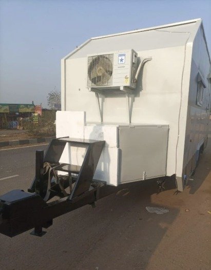 Caravan front with air-conditioner unit and tow hitch