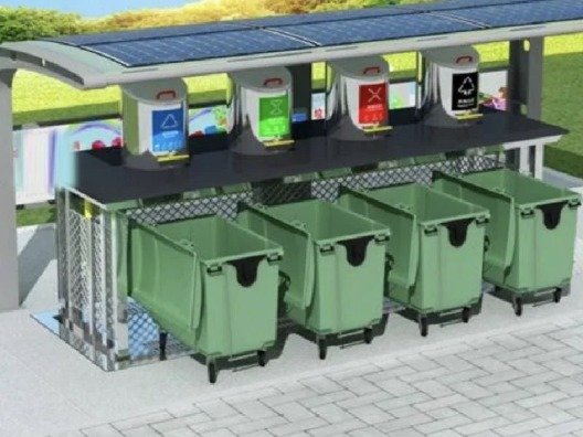 UTC underground dust bin — containers lowered below a solar-roofed collection point